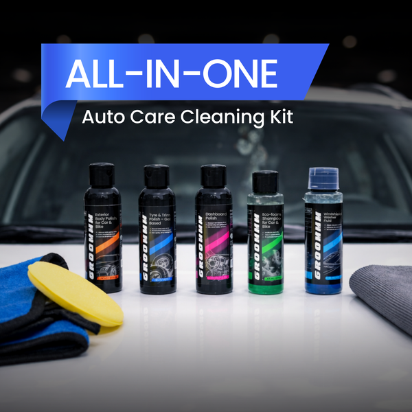 Set of car care products including bottles and cloths with 'All-in-One Auto Care Cleaning Kit' text.