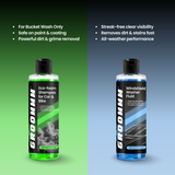 Two bottles of GROOMM car care products on a green and blue gradient background.